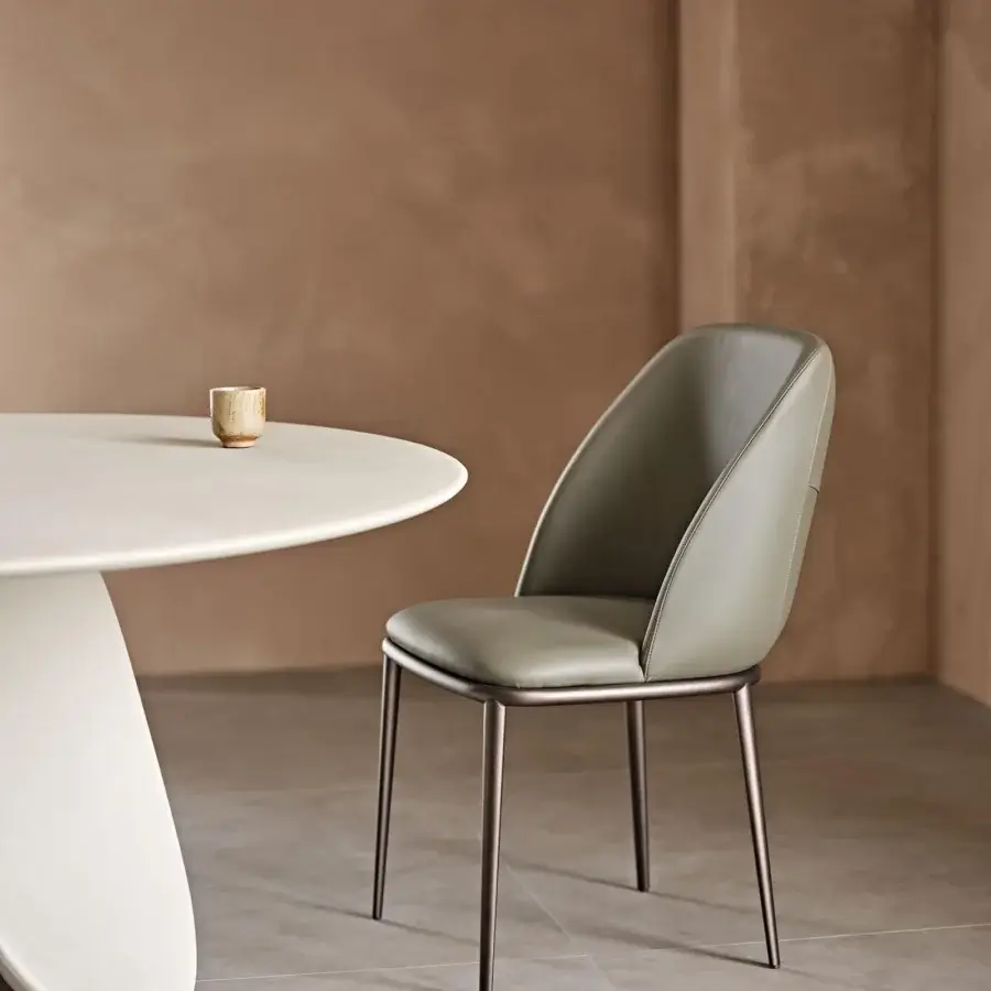 Sophisticated Cattelan Italia Mariel ML chair with muted green synthetic leather upholstery and refined metal base