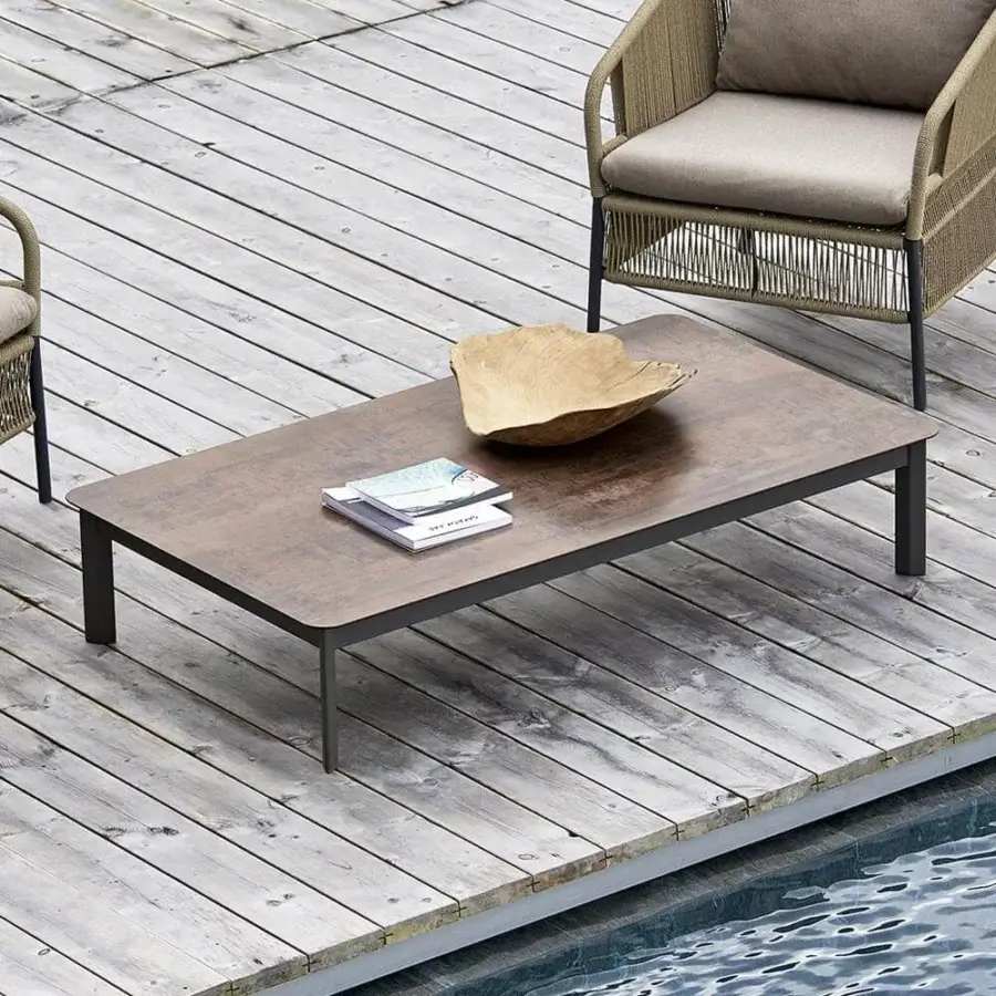 Distinguished Varaschin System coffee table with a textured medium brown HPL tabletop and dark gray powder-coated aluminum base