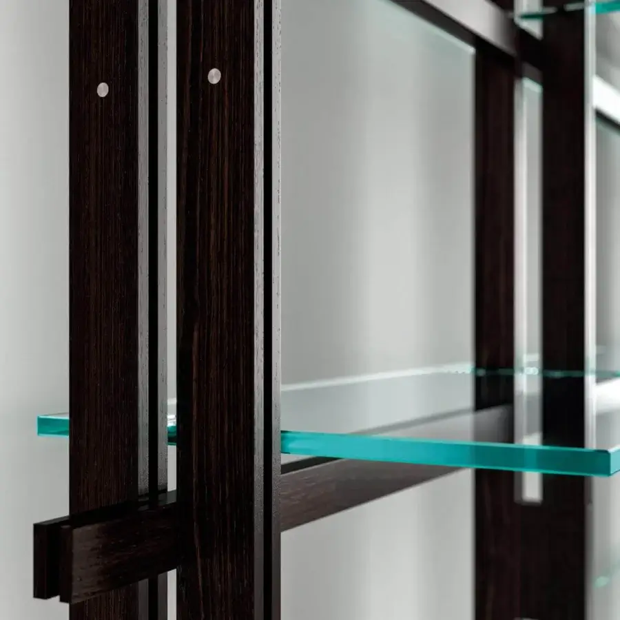 Elegant Tonelli Design Hemingway bookcase built with Siberian ash uprights, sleek glass shelving and polished chrome supports