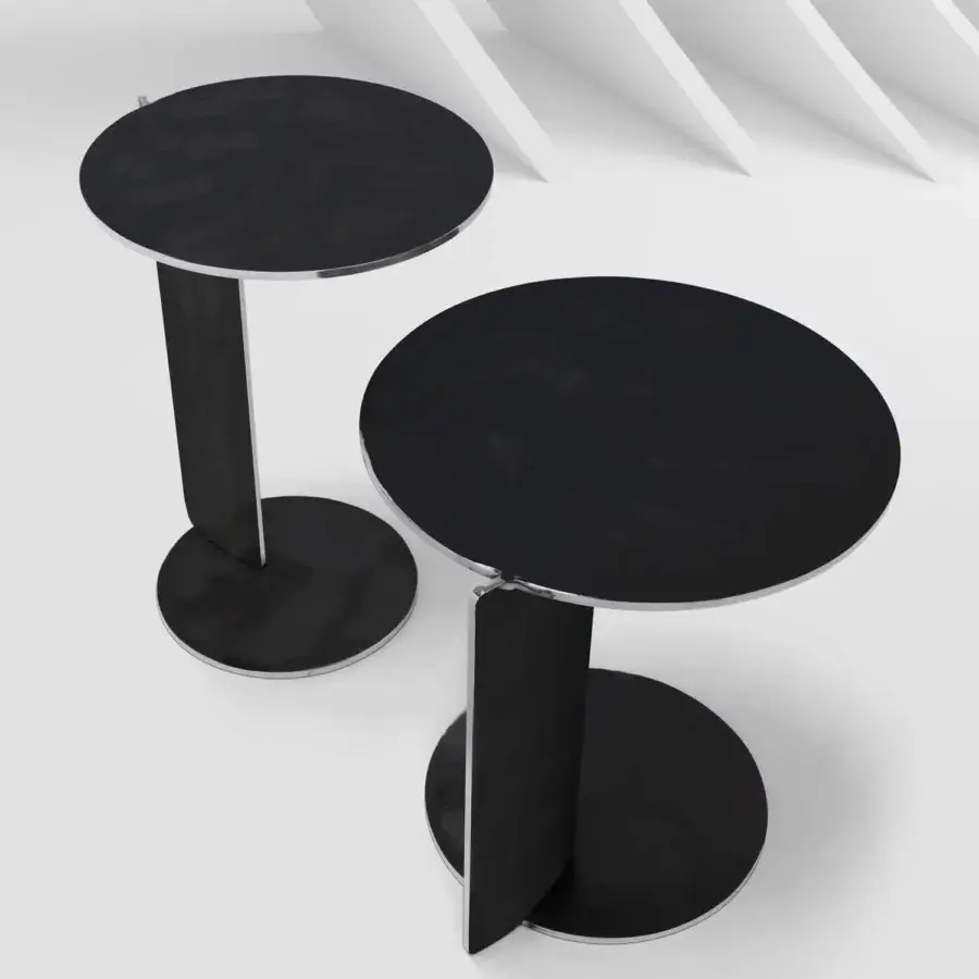 Exceptional Arketipo Joystick side table crafted in Italy with joined discs and curved metal leg in matte black finish with silver accents