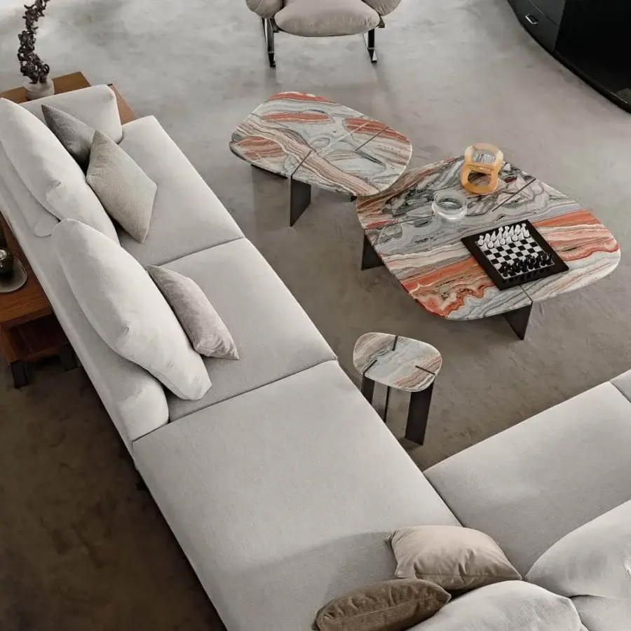 Distinguished Arketipo Rumors coffee table crafted in Italy with swirling grey, white, and orange composite and dark metal blades with a glossy finish