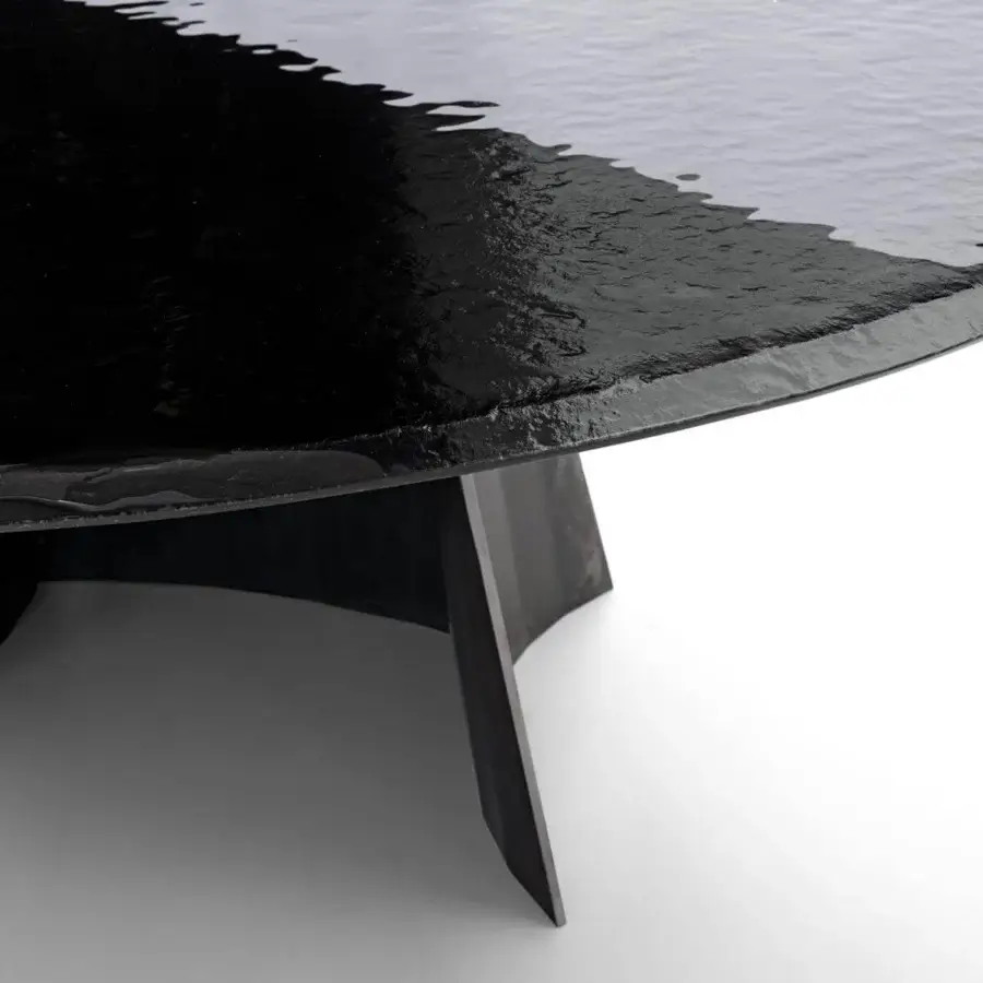 Exceptional Arketipo Avalon table with rippling annealed glass and a sculpted dark matte iron base