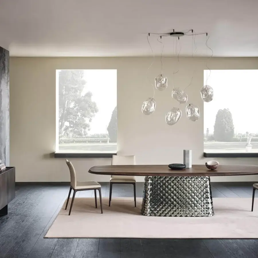 Distinguished Cattelan Italia Atrium Wood table with barrel top in Canaletto walnut and geometrically textured reflective base