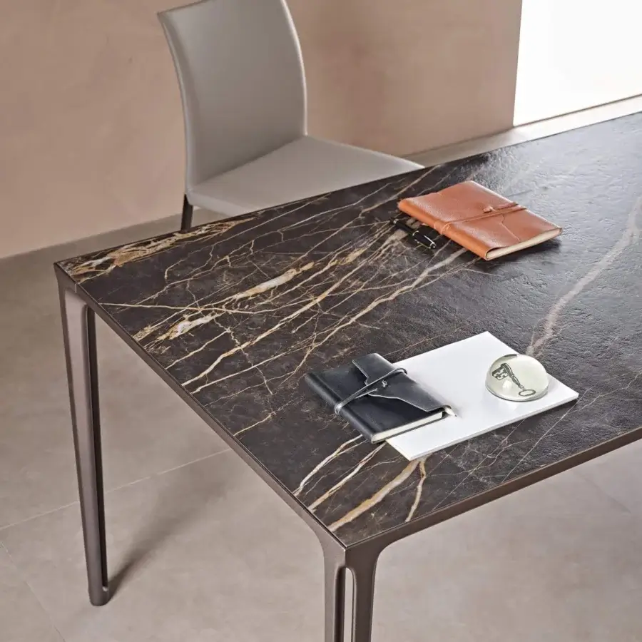 Captivating Cattelan Italia Boulevard table with ceramic Marmi top and embossed lacquered aluminum legs in matte finish