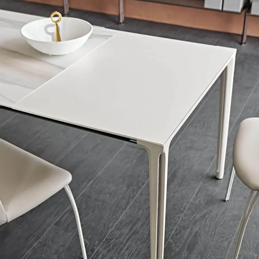 Elegant Cattelan Italia Boulevard table with white lacquered aluminum and ceramic Marmi tabletop exhibiting a marbled finish