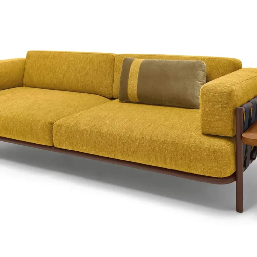 Captivating Arketipo Punta Ala sofa with enveloping geometric shapes and soft mustard-yellow cushions crafted with a braided backrest and integrated wood table