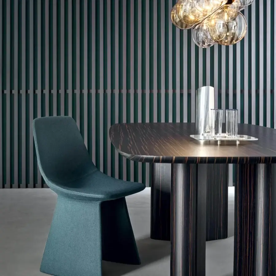 Distinctive Bonaldo Agea chair with rounded organic silhouette upholstered in muted teal fabric and steel structure