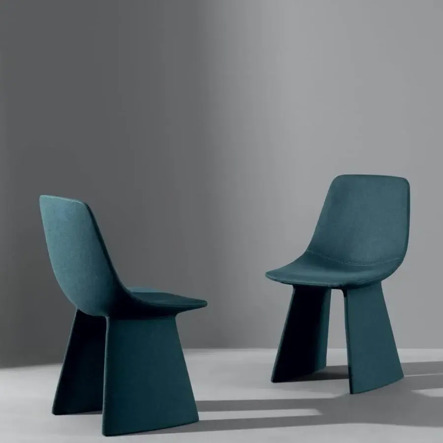 Sophisticated Bonaldo Agea chair with curved seat and geometric base crafted in teal fabric with a steel structure