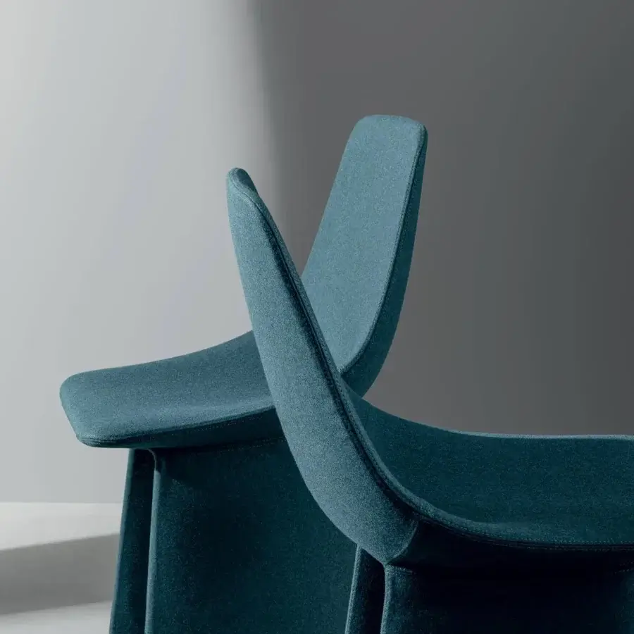 Exceptional Bonaldo Agea chair with teal fabric enveloping cold-foamed polyurethane and a monolithic steel base