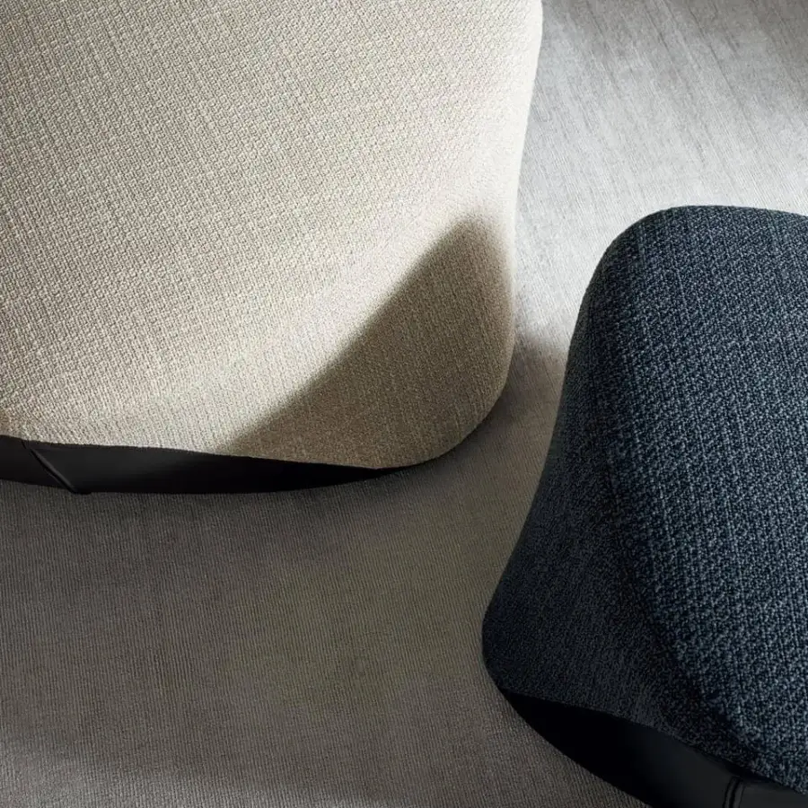 Exceptional Bonaldo Seki ottoman with light beige woven textile and dark trim presenting a smooth irregular form