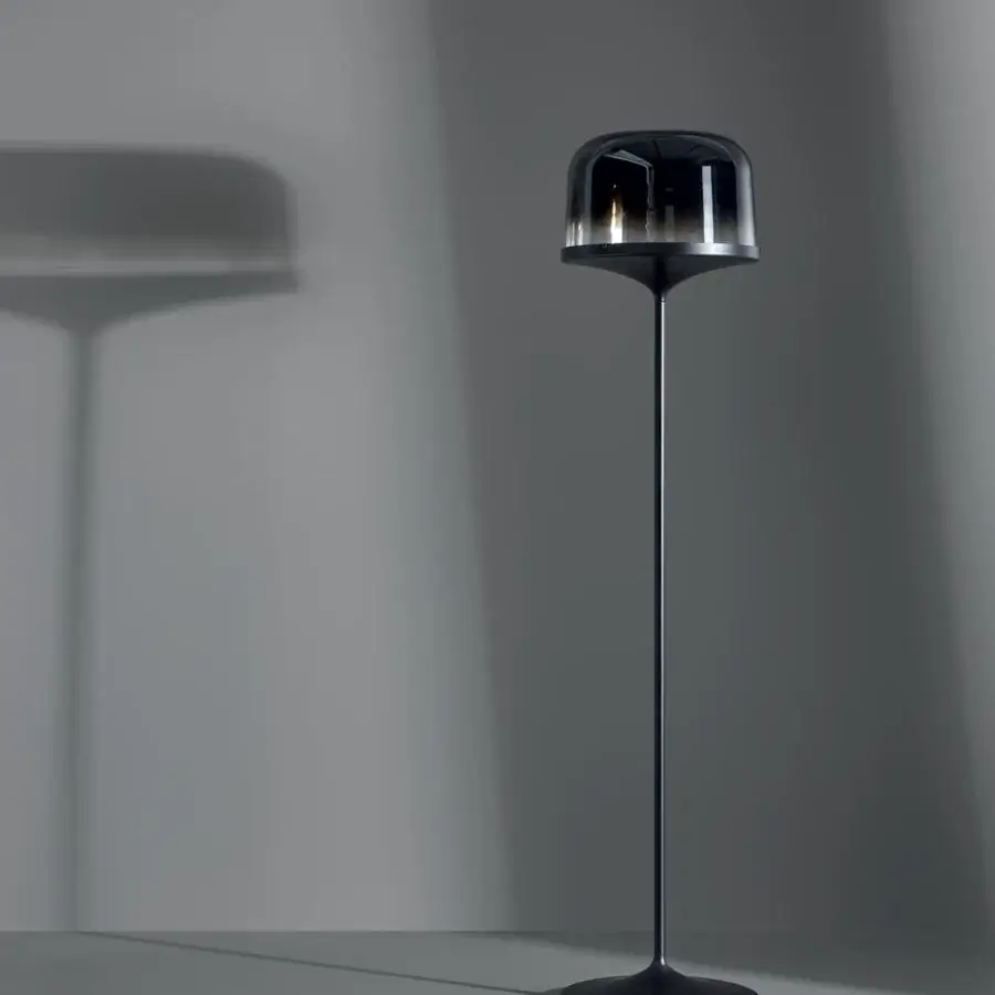 Exceptional Bonaldo Pin floor lamp crafted in lead metal with a smoked blown glass lampshade and sleek black finish