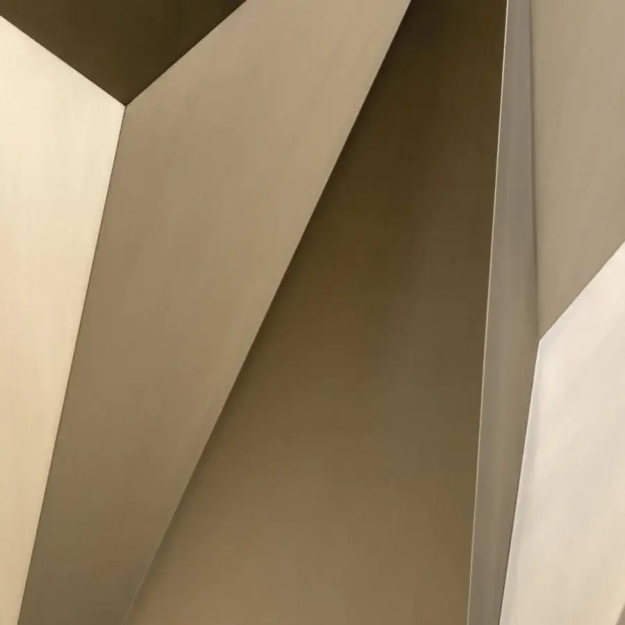 Distinguished Reflex Origami table with faceted wood base in varying shades of tan and brown and glass surface