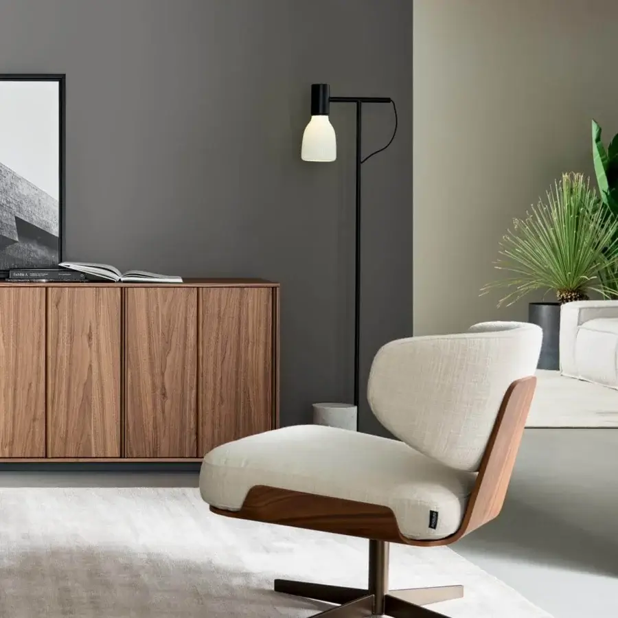Elegant Bonaldo Olos lounge chair with curved wood structure and light beige textile upholstery