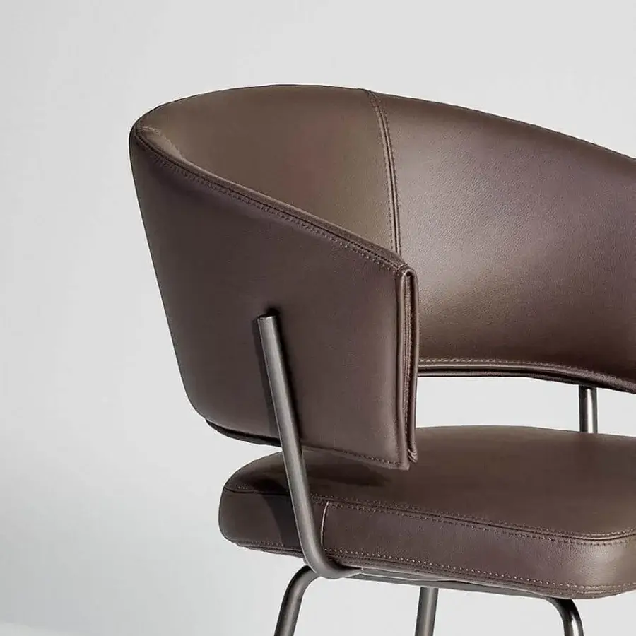 Refined Bonaldo Bahia stool with supple brown leather upholstery and a rigorous dark metal steel structure