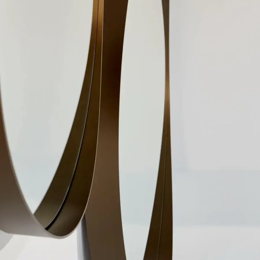Exceptional Bonaldo Adone mirror with interlocking oval silhouette and bronze-toned metal frame crafted in Italy