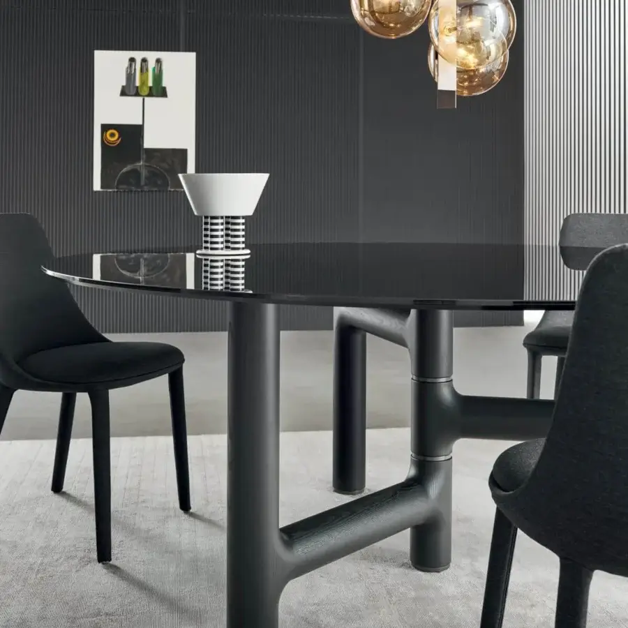 Distinguished Bonaldo Pivot table with glossy black glass top and solid wood base crafted with refined metal inserts in matte black finish