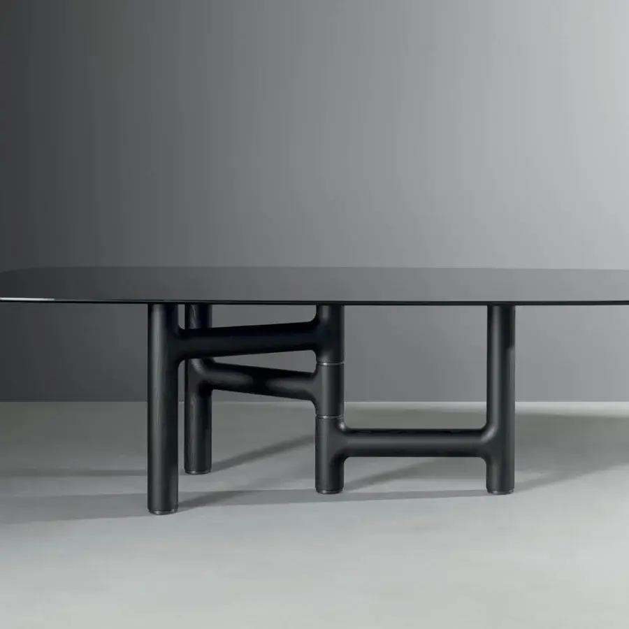 Superior Bonaldo Pivot table with dark rectangular top and uniquely structured solid wood base with metal inserts