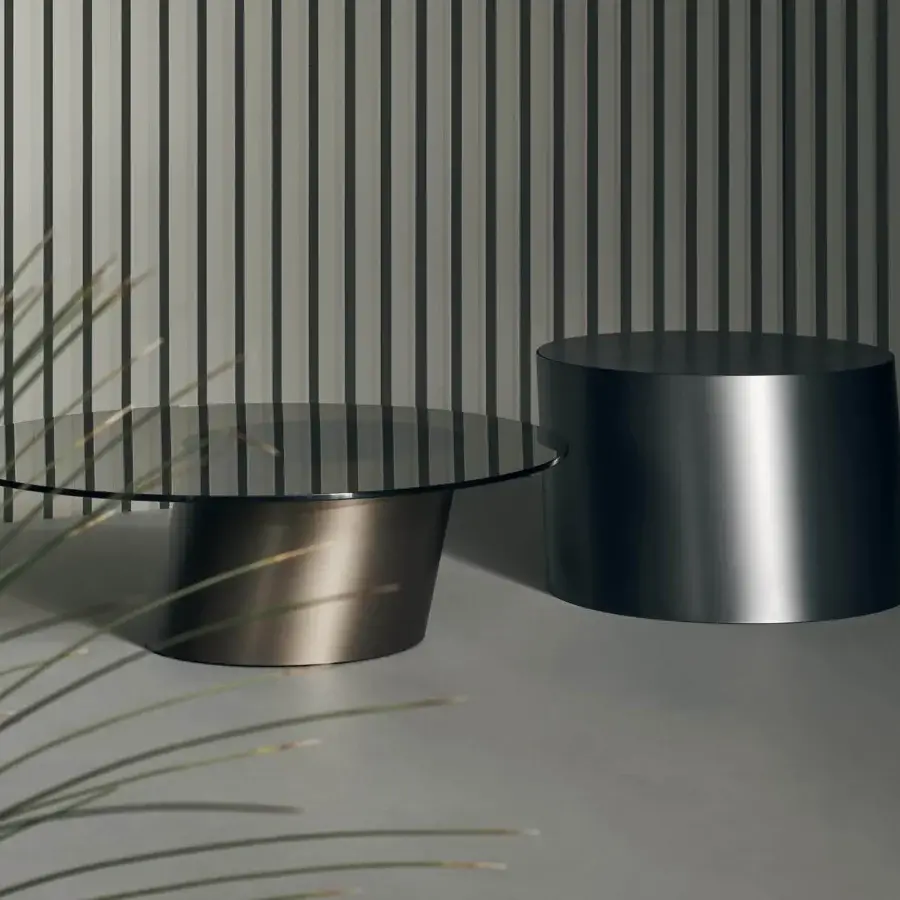 Elegant Bonaldo Pisa coffee table with round glass top and satin bronze cylindrical metal base