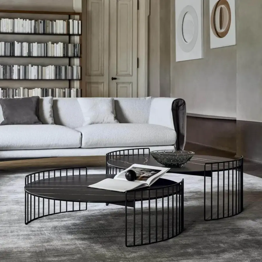 Distinguished Bonaldo Harpe coffee table with harp-inspired metal base and dark-toned top suggesting a sophisticated stone-like texture