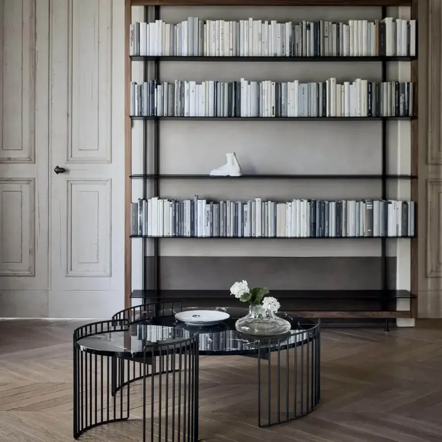 Elegant Bonaldo Harpe coffee table with visually light metal base encircling a striking dark marble-like top