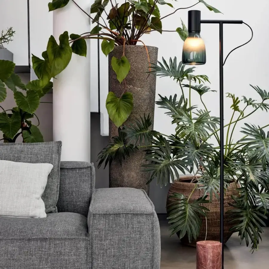 Distinguished Bonaldo Acquerelli floor lamp with lead metal structure and hand-crafted light blue-green blown glass lampshade in pink-toned marble