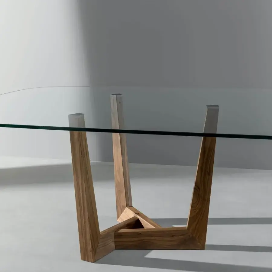 Exceptional Bonaldo Art Wood table with transparent glass top and sculpted solid American walnut wood base exhibiting a smooth finish