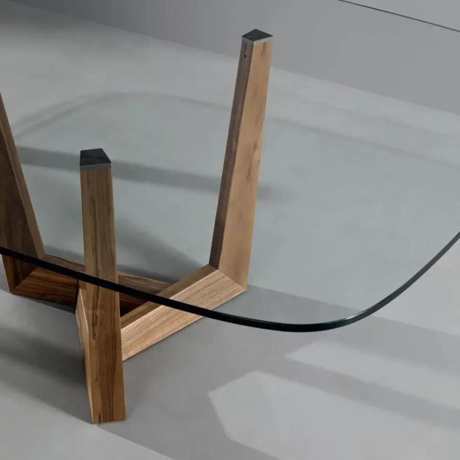 Distinguished Bonaldo Art Wood table with a refined transparent glass top and sculpted solid American walnut wood base in a medium-toned finish