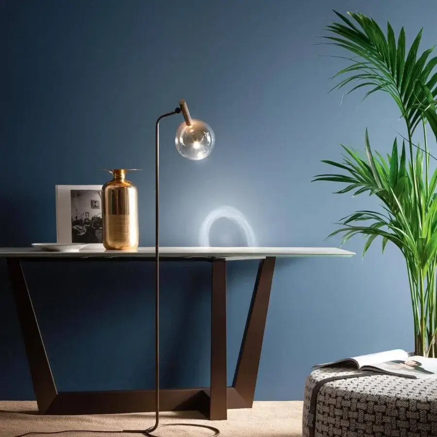 Elegant Bonaldo Sofi floor lamp with amber borosilicate glass globe and burnished brass cylinder