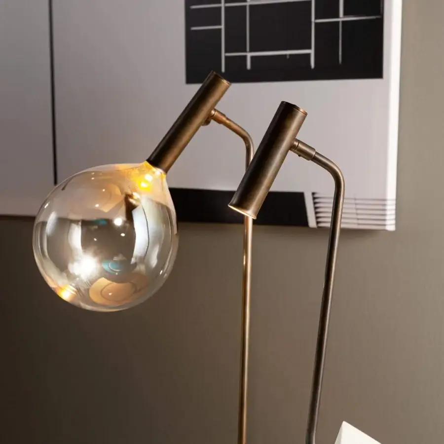 Exceptional Bonaldo Sofi table lamp with warm amber borosilicate glass and burnished brass cylinder crafted with captivating internal reflections