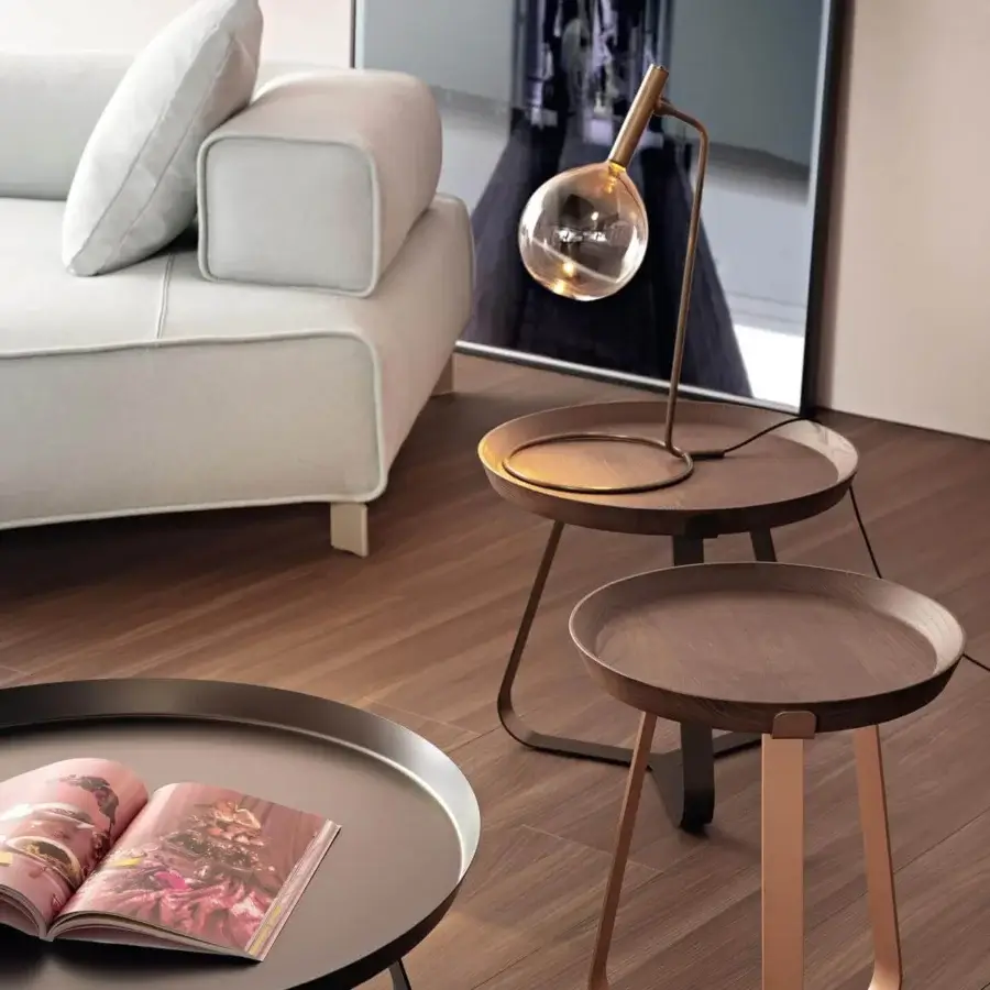 Elegant Bonaldo Sofi table lamp with warm amber borosilicate glass and burnished brass cylinder built on a wooden base