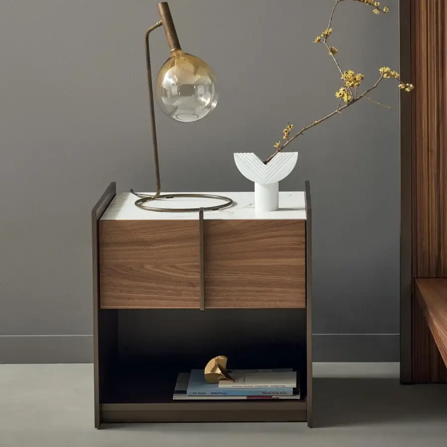 Distinguished Bonaldo Sofi table lamp with a warm amber borosilicate glass globe and burnished brass cylinder construction