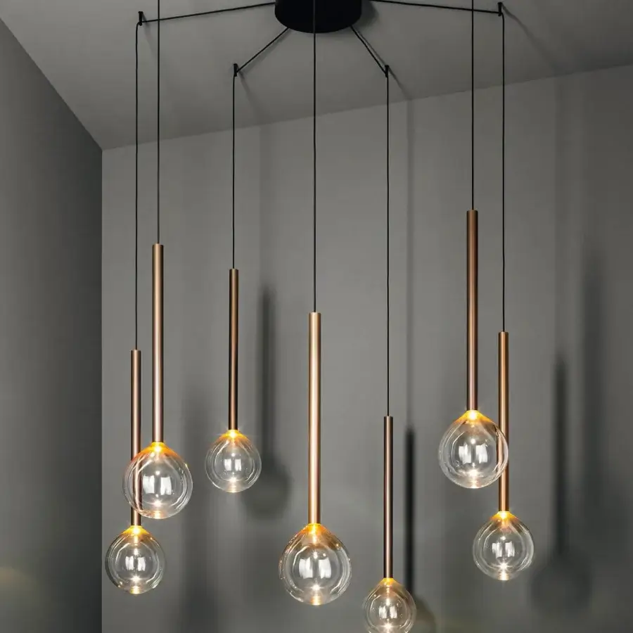 Exceptional Bonaldo Sofi suspension lamp with a warm amber borosilicate glass globe and burnished brass cylinder