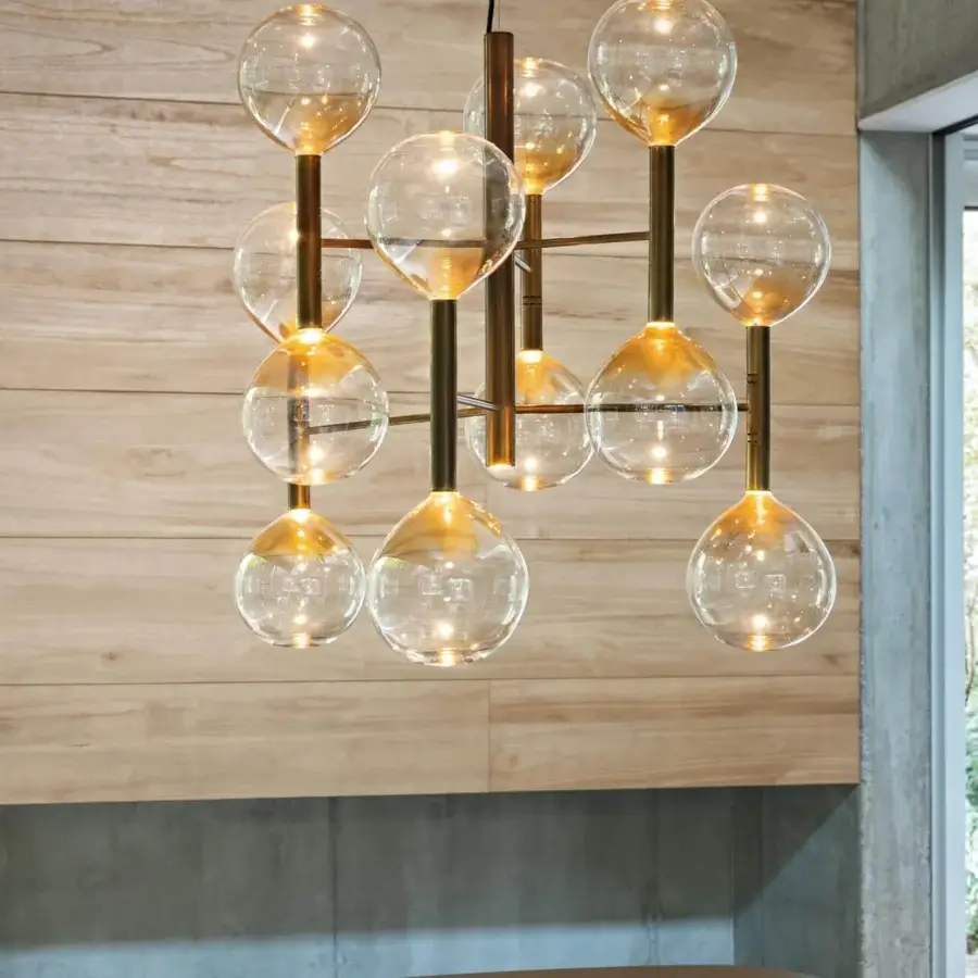 Superior Bonaldo Sofi suspension lamp with thirteen warm amber borosilicate glass globes and burnished brass cylinders