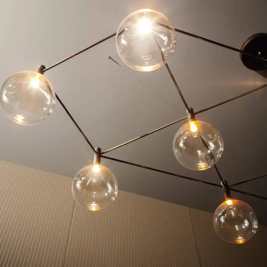 Exceptional Bonaldo Sofi suspension lamp with a warm amber borosilicate glass globe and burnished brass housing
