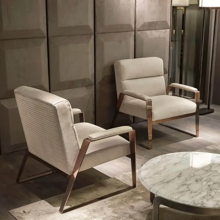 Superior DV Home Collection Hollywood lounge chair upholstered in light beige textile with a glossy metal frame and quilted back