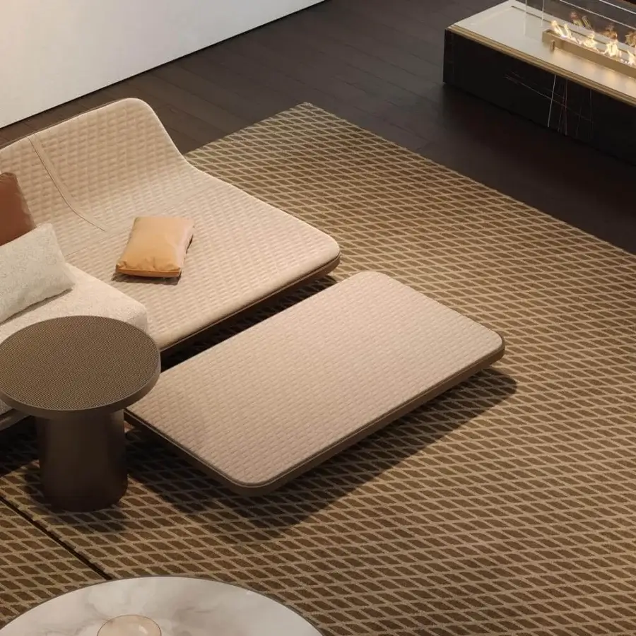 Distinguished Reflex Segno coffee table with medium brown leather top and matching brown metal legs showcasing quilted detail