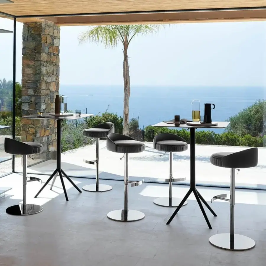 Distinguished Potocco Plissé stool with black textile upholstery and silver-toned metal swivel base built with a pleated perimeter