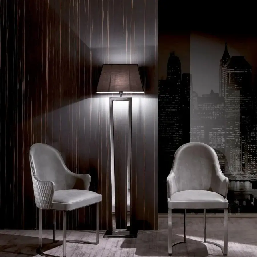 Distinguished DV Home Collection Deco armchair with beech plywood shell and light gray textile upholstery, built with a reflective metal base