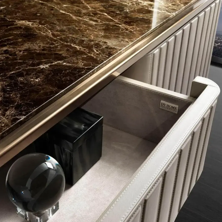 Elegant DV Home Collection Elite sideboard with light beige leather front, dark brown marble top, and matt lacquered interior