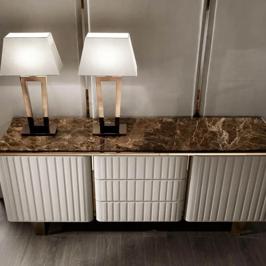 Exclusive DV Home Collection Elite sideboard with white leather front, faux marble top and gold accents, finished with a matt lacquered interior