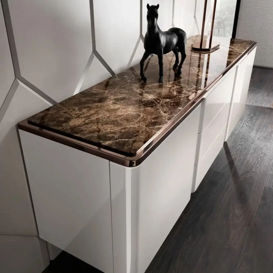 Elegant DV Home Collection Elite sideboard with glossy white lacquered finish and complex brown marble-patterned top with bronze trim