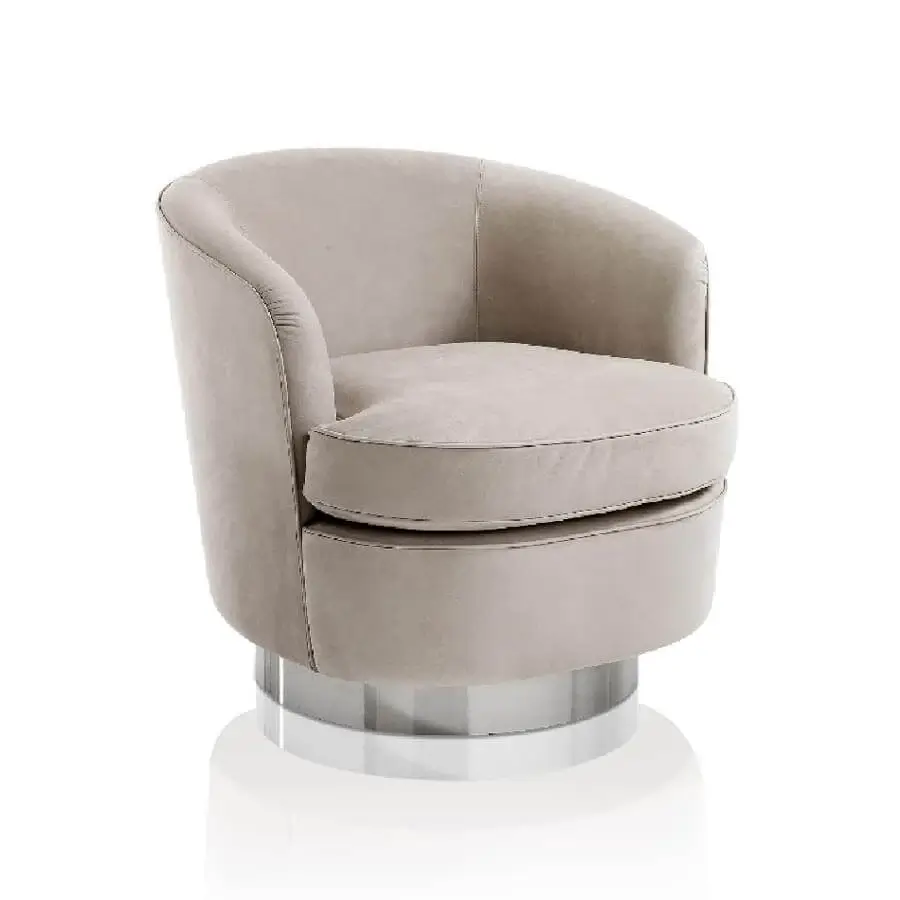 Distinguished DV Home Collection Coco lounge chair with curved silhouette upholstered in matte beige textile and glossy stainless steel base