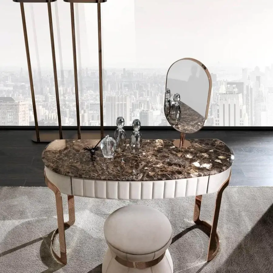 Distinguished DV Home Collection Coco ottoman in creamy off-white fabric with smooth finish and bronze tone steel insert