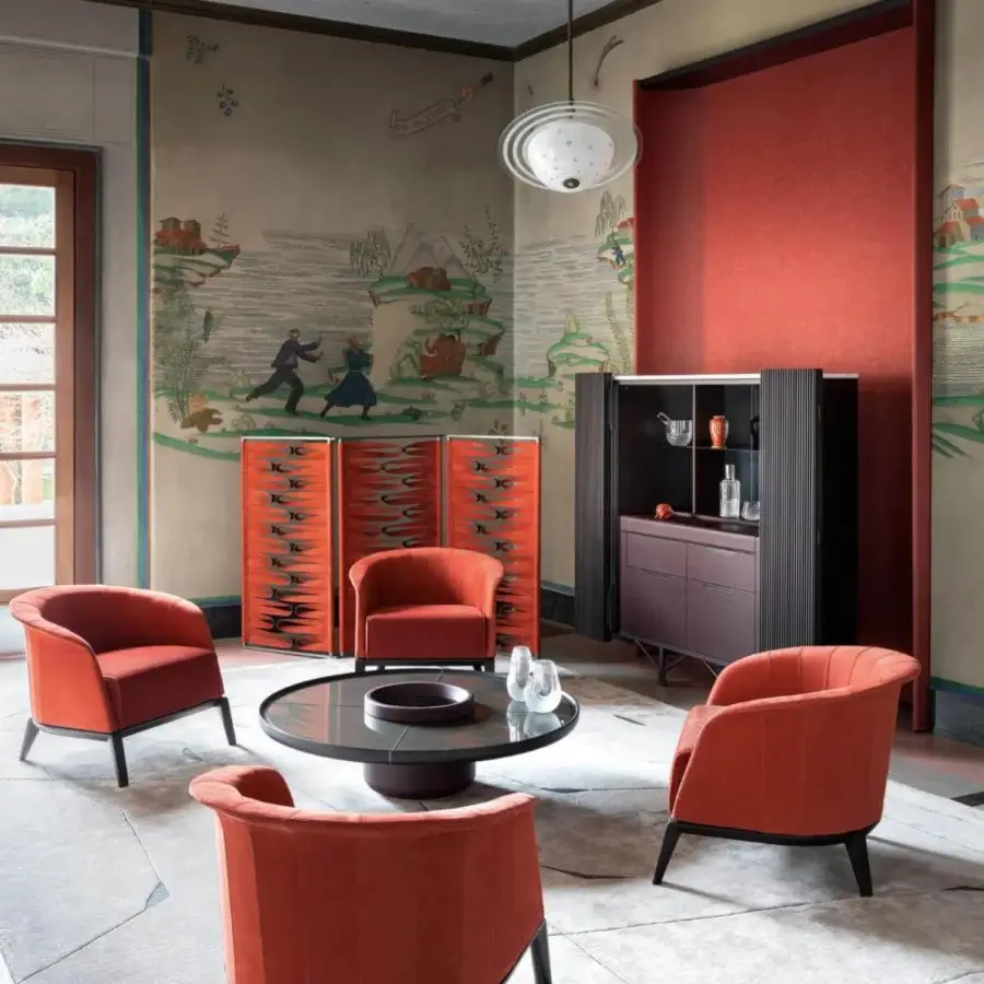 Innovative Giorgetti Borealis room divider with rotating aluminum panels and a glossy red-orange leather band finish