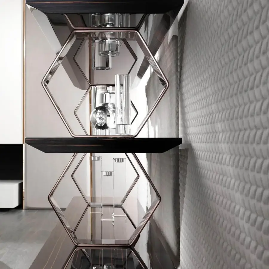 Elegant DV Home Collection Deco bookcase with hexagonal metal elements and high-gloss lacquered shelves in dark tones