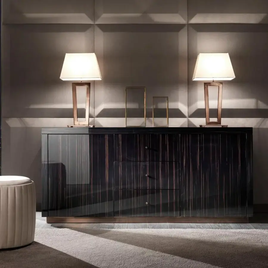Sophisticated DV Home Collection Deco table lamp with a geometric silhouette and bronze-toned metal frame with a light textile lampshade