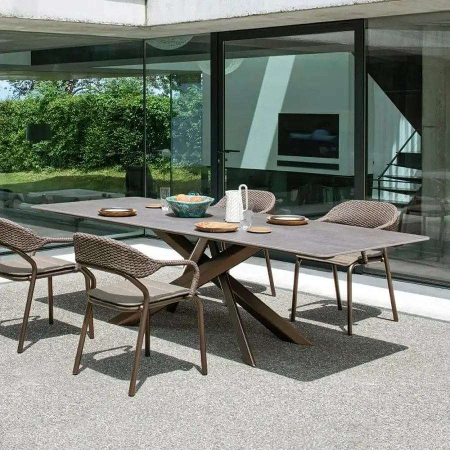 Refined Varaschin System Star table with extruded aluminum base and durable HPL tabletop in muted gray with textured matte finish