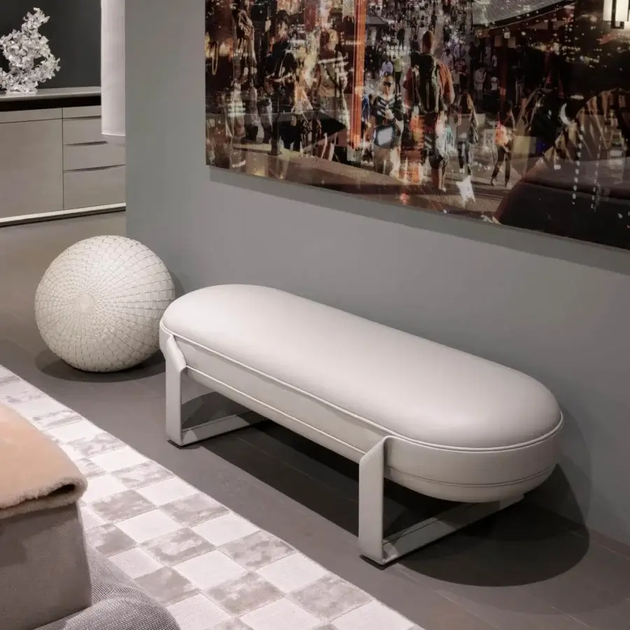Innovative Giorgetti Shirley bench with a soft oval form upholstered in smooth light gray fabric and metallic structure