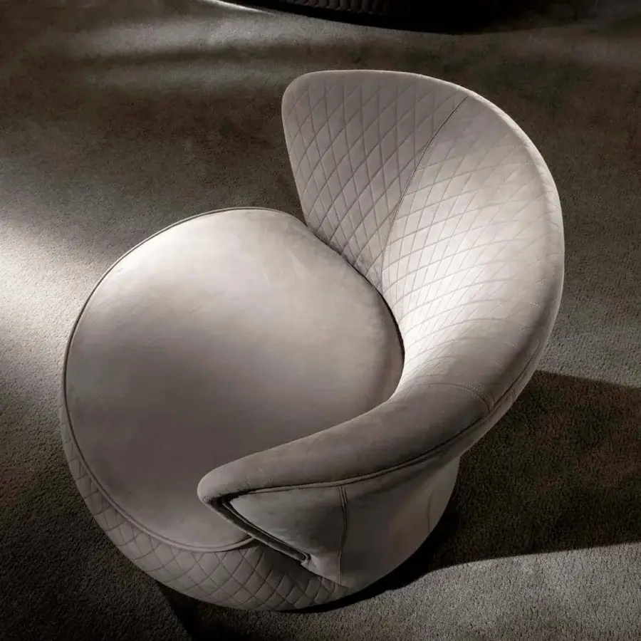 Distinguished DV Home Collection Soho lounge chair with gray quilted fabric upholstery and a swivel base built with solid wood