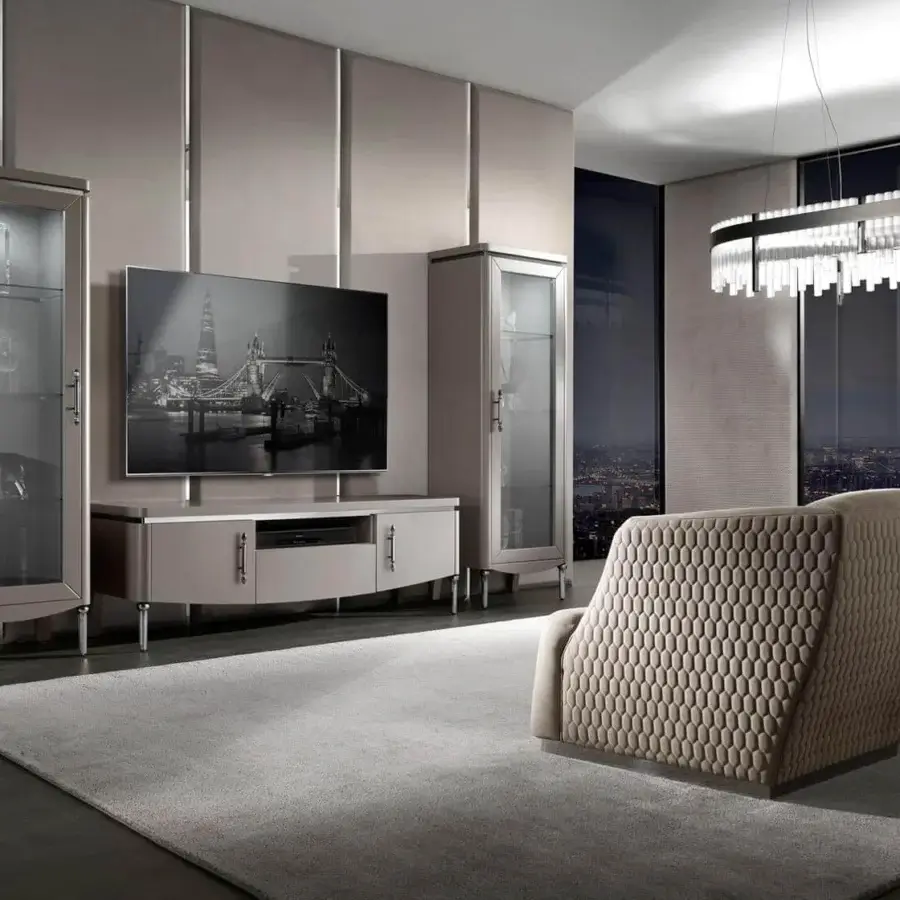 Sophisticated DV Home Collection Venice lounge chair with textured beige textile and sleek metal base crafted with a solid wood structure